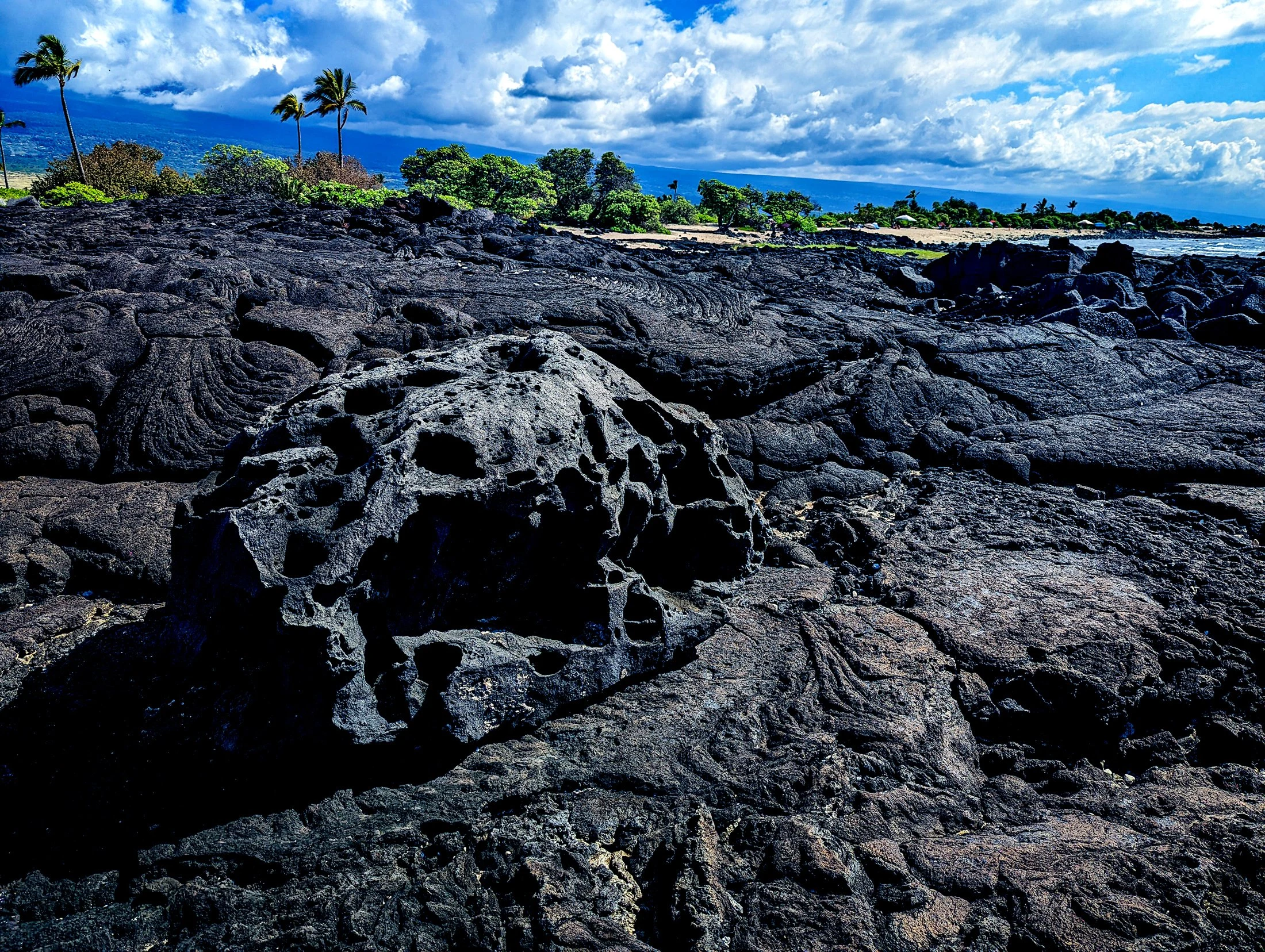 Lava rock formations on a beach in hawaii