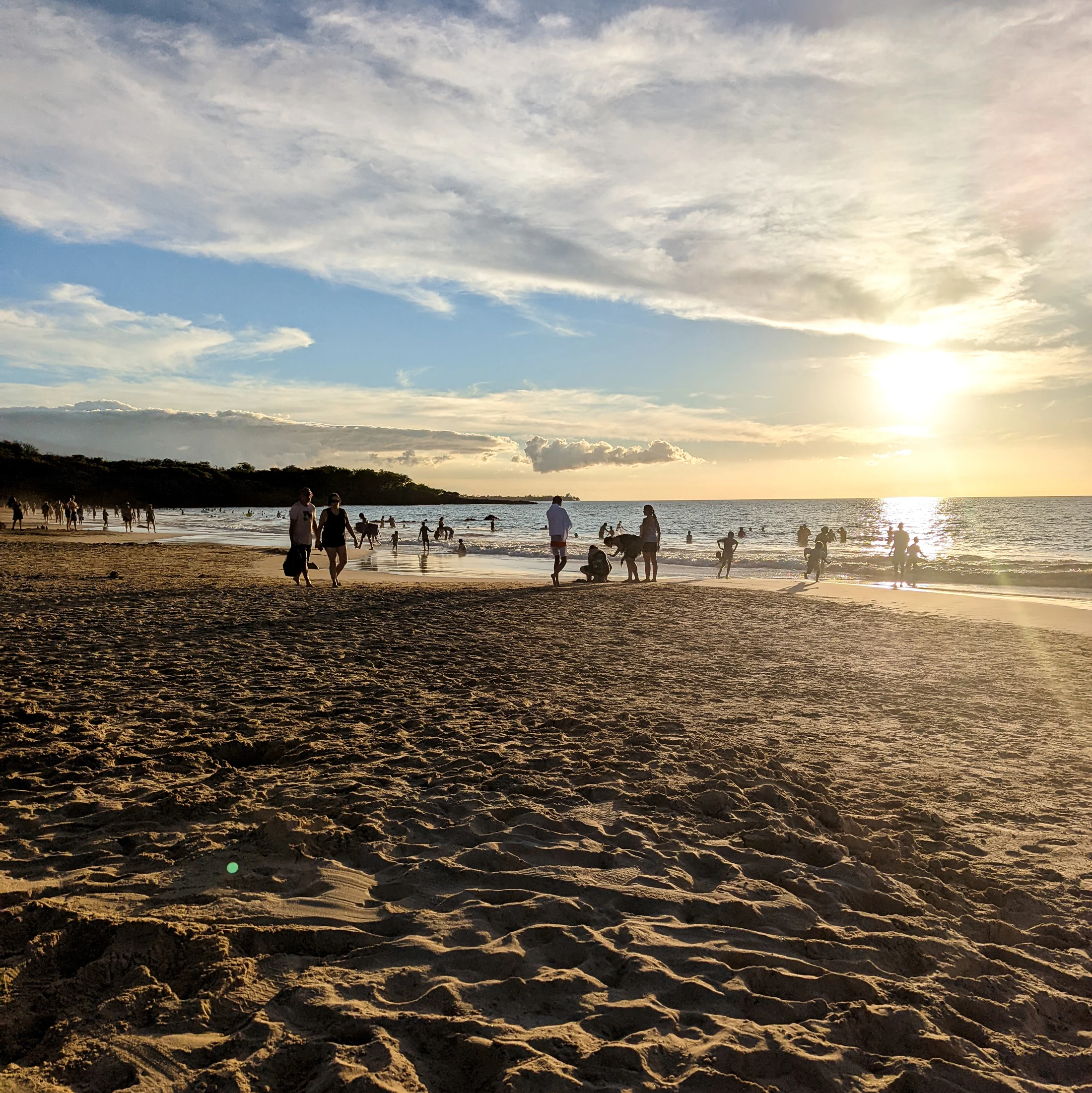 Beachgoers enjoy a sandy tropical beach on christmas day in 2021.