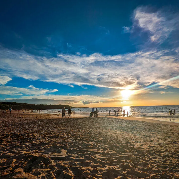 Beachgoers enjoy a sandy tropical beach on Christmas Day in 2021.