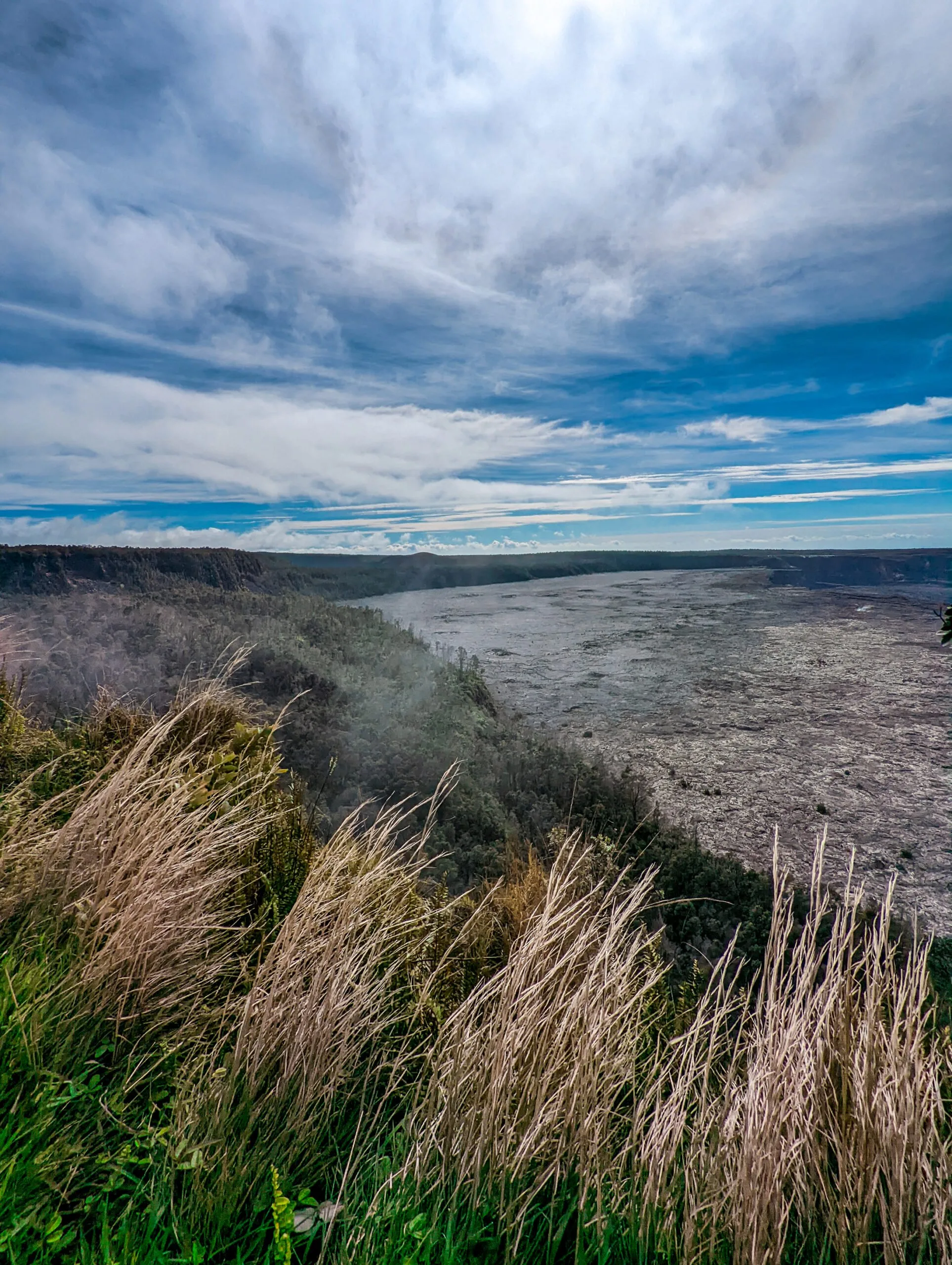 A landscape photograph taken of the crater at hawaii volcanoes national park..