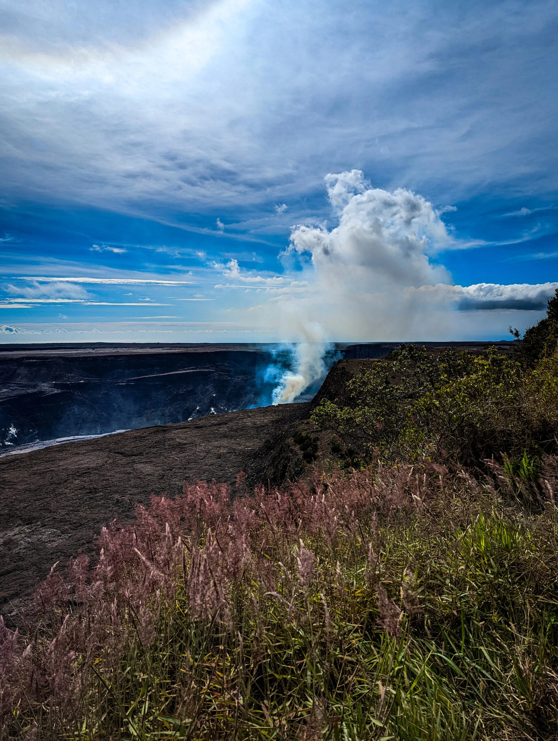 A landscape photograph taken of the crater at hawaii volcanoes national park..