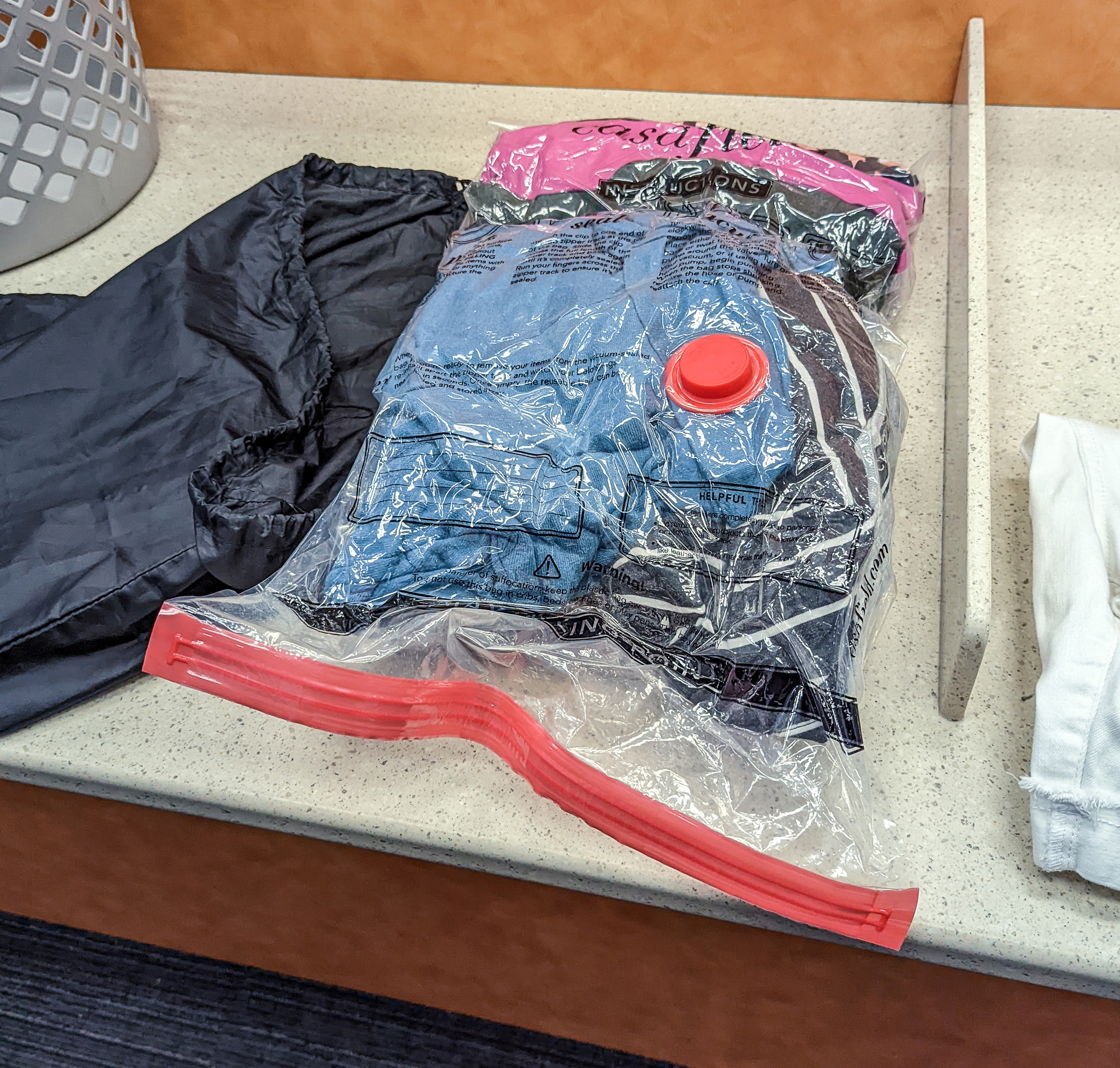 Clean clothing packed inside of a large resealable bag to prevent ambient moisture from making clothing feel the.