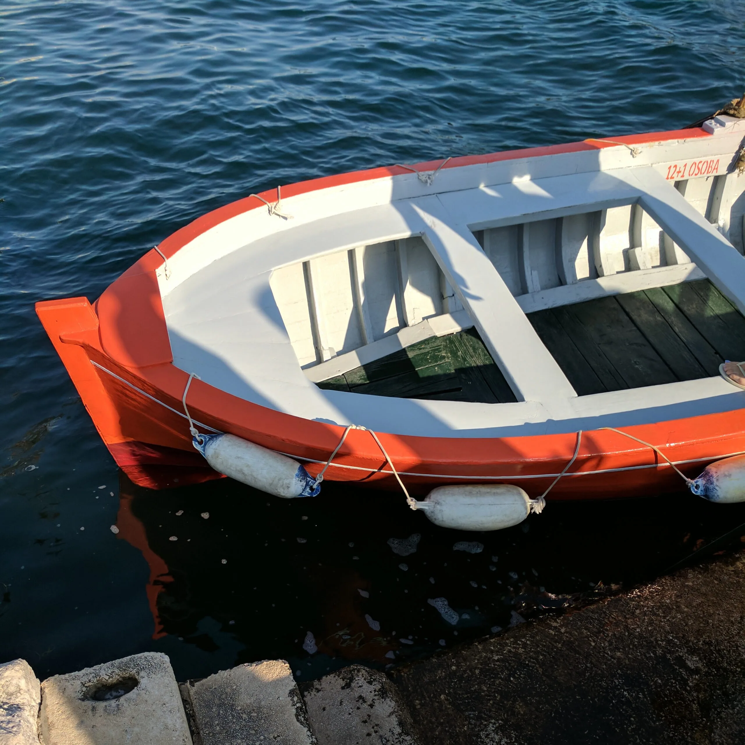 Small rowboat docked in zadar croatia.
