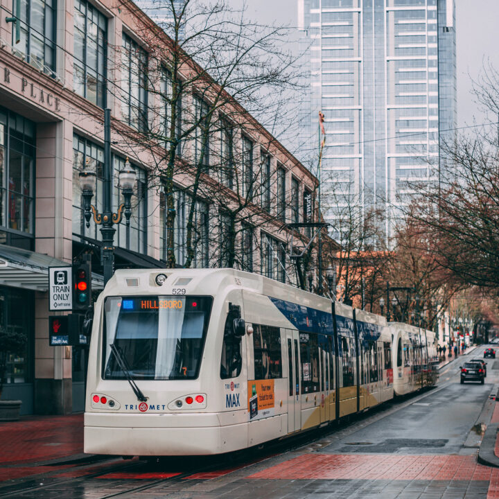 portlands light rail train in downtown, showing an easy way for tourists to navigate the city without a car.