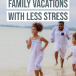A family running down the beach on vacation.
