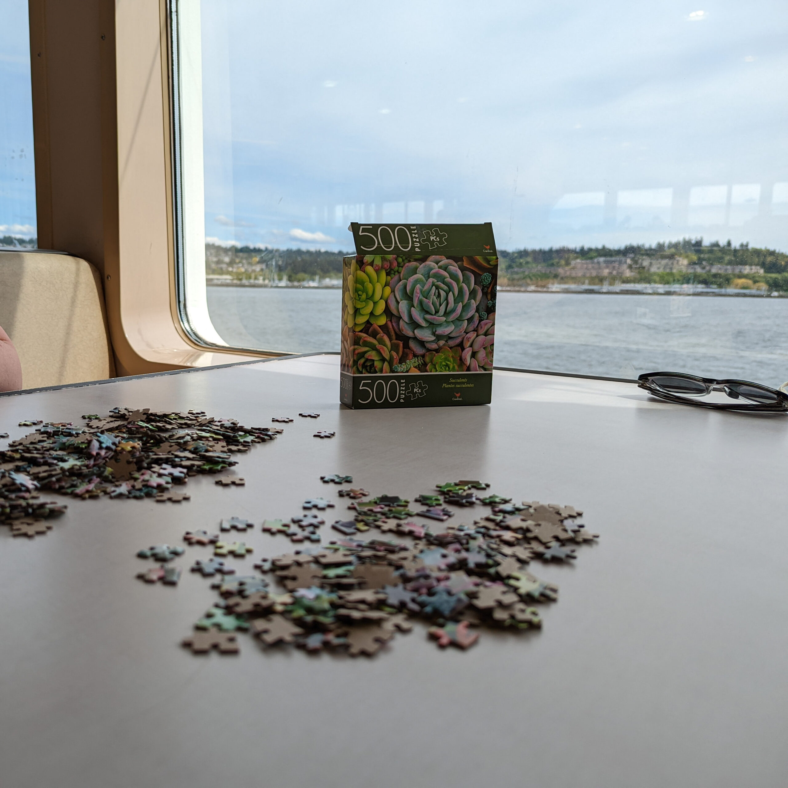 A puzzle on a tabletop on a washington state ferry.