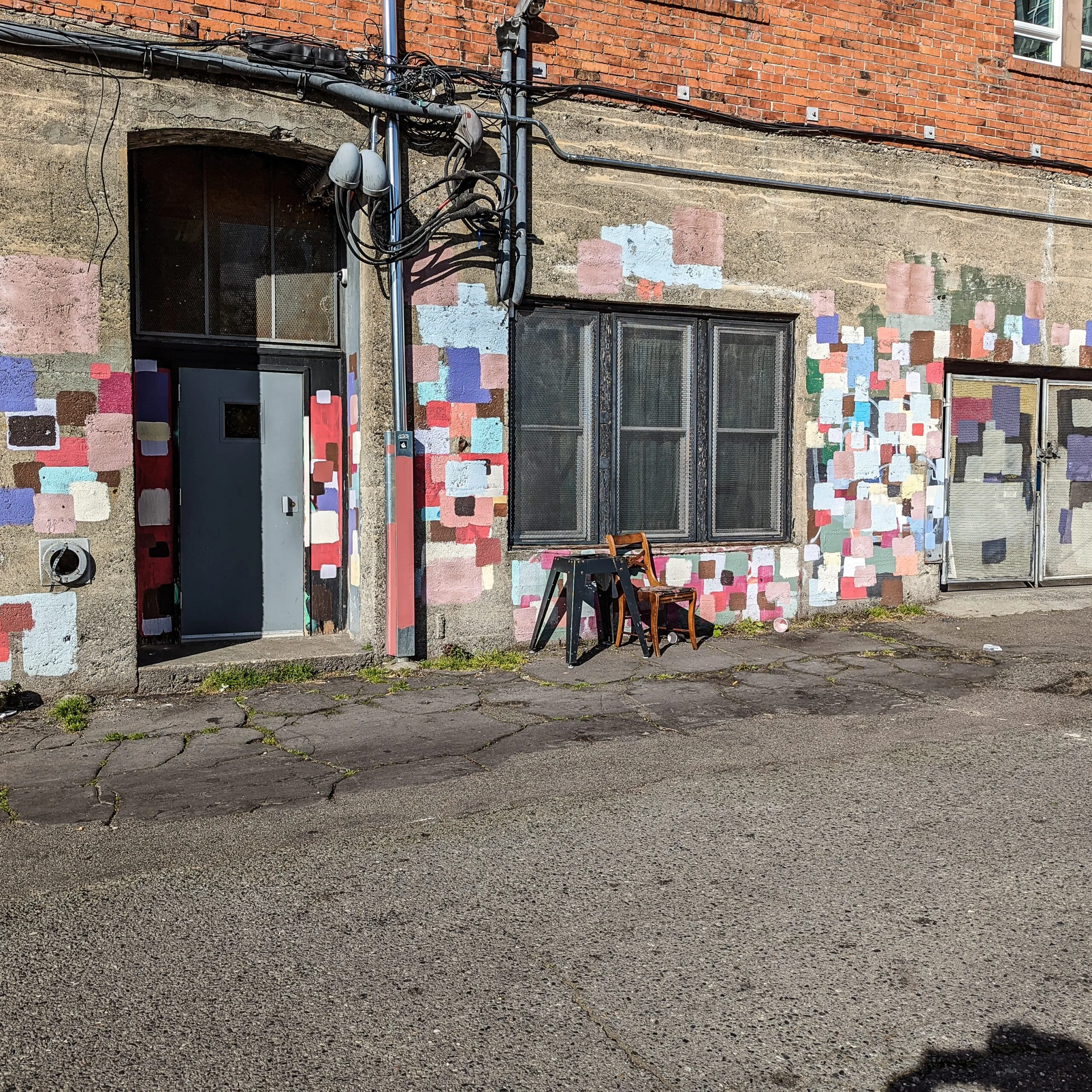 The evolving art project behind the reveille apartments in seattle washington.