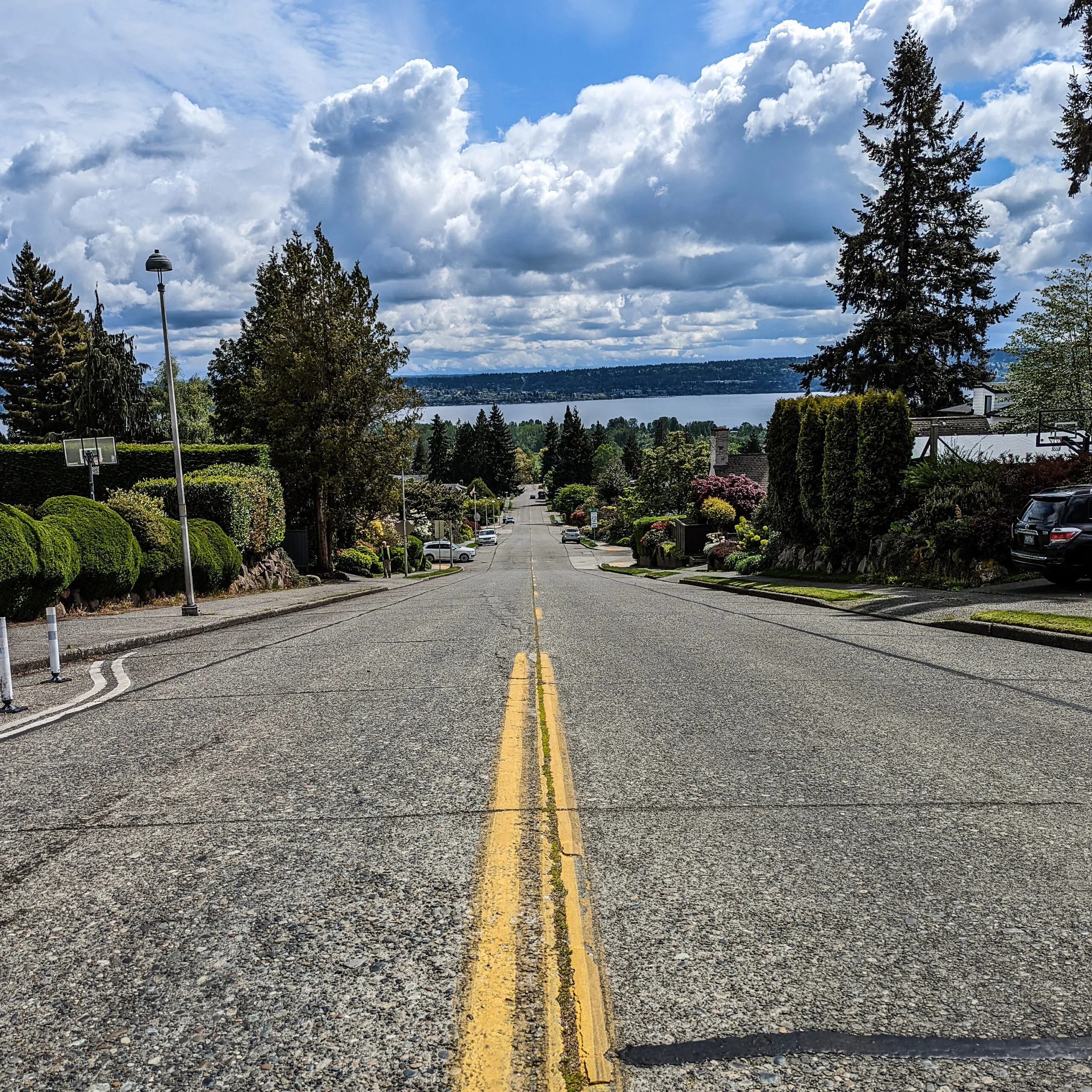A neighborhood street in seattle descending towards lake washington.