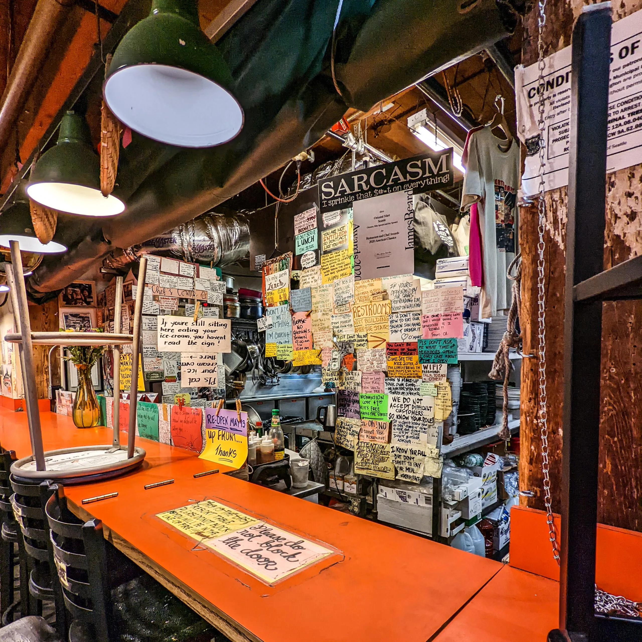 Oriental mart signs at the food counter at pike place market.