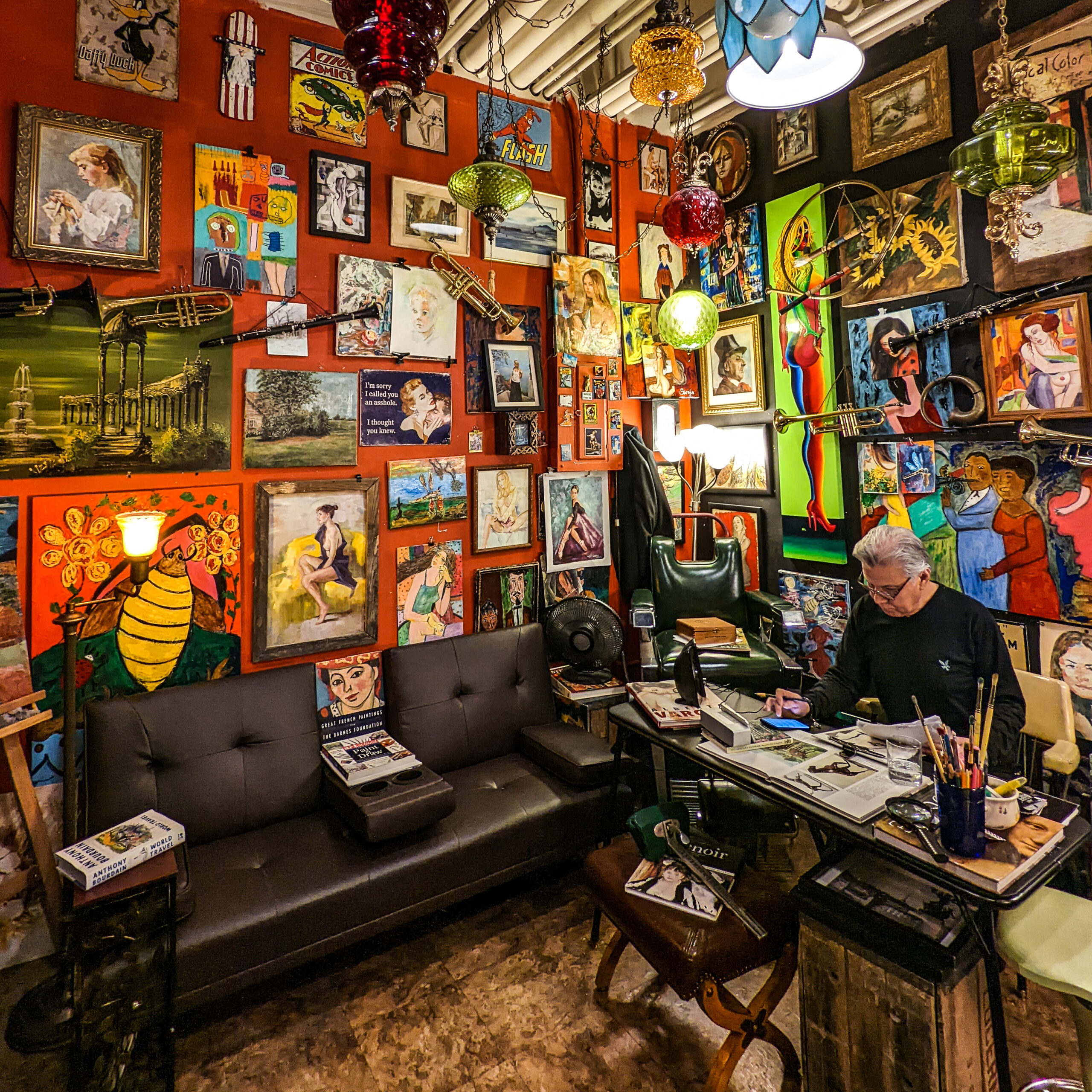 An art filled the barbershop at pike place market in seattle washington.