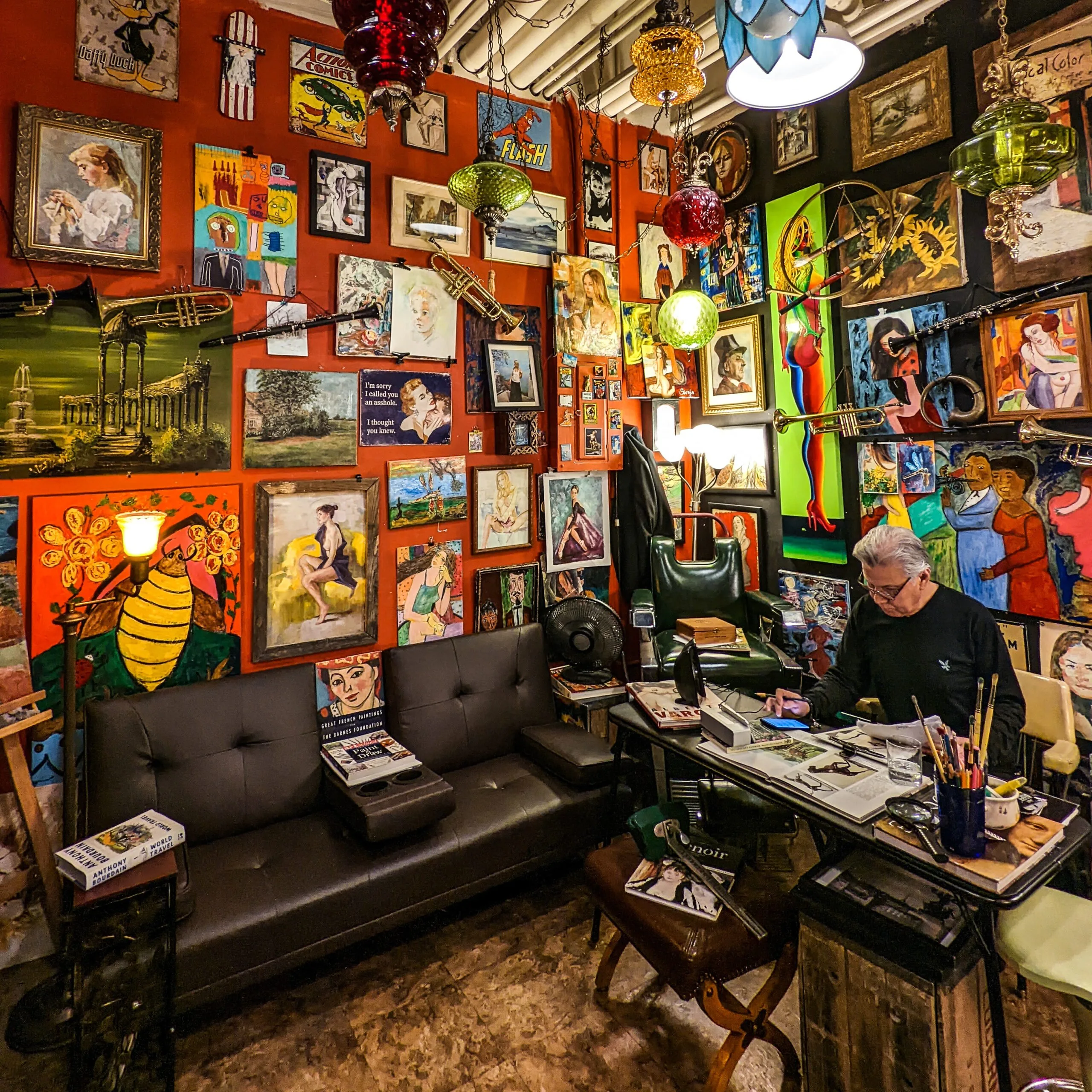 An art filled the barbershop at pike place market in seattle washington.