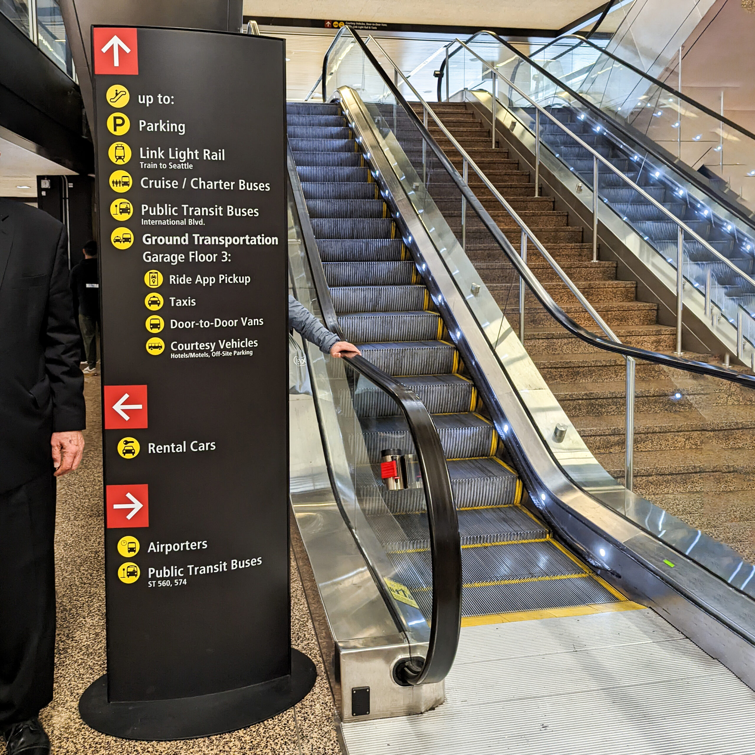 A navigation sign at seatac airport.