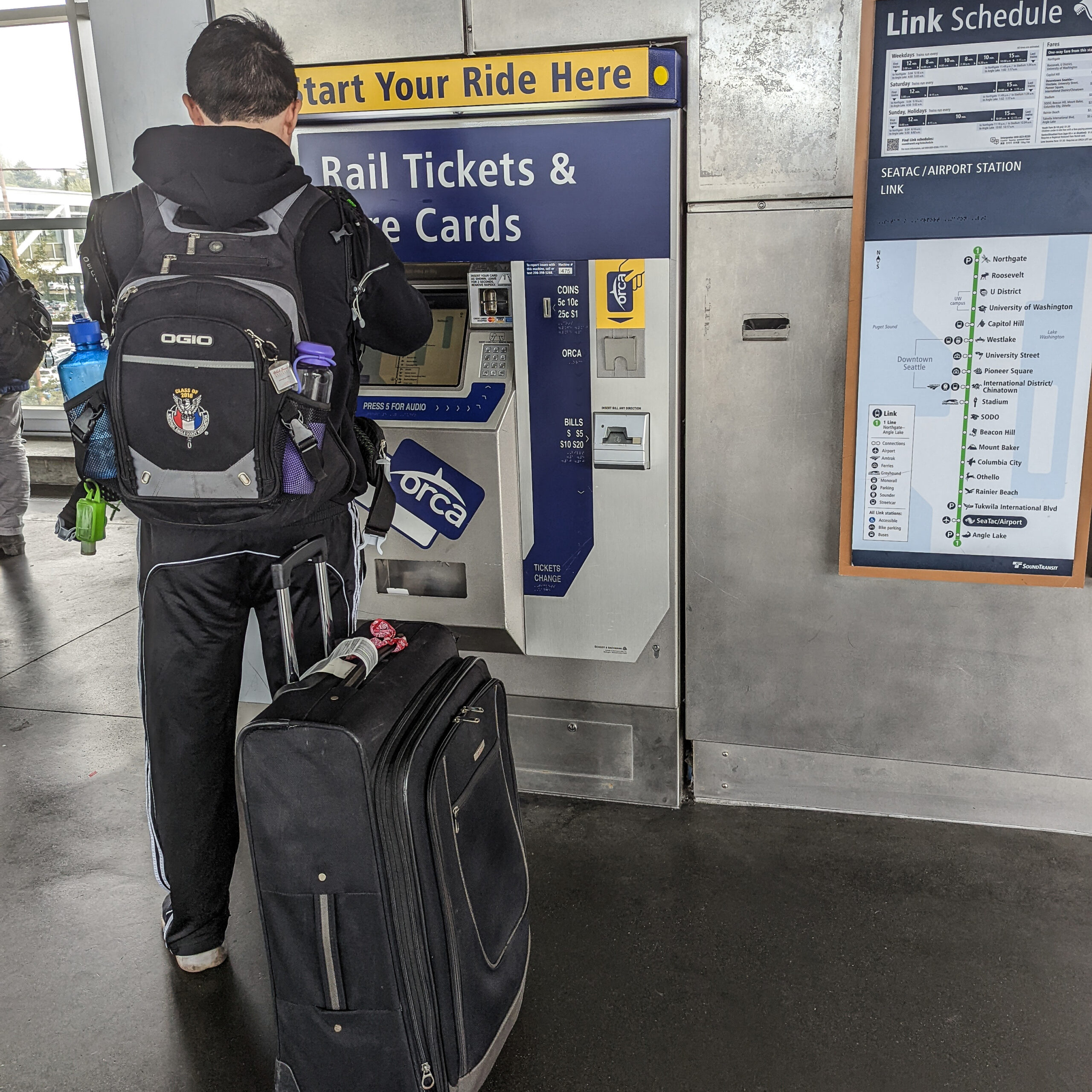 Images of a ticket vending machine at the light rail station at seattle's seatac airport.