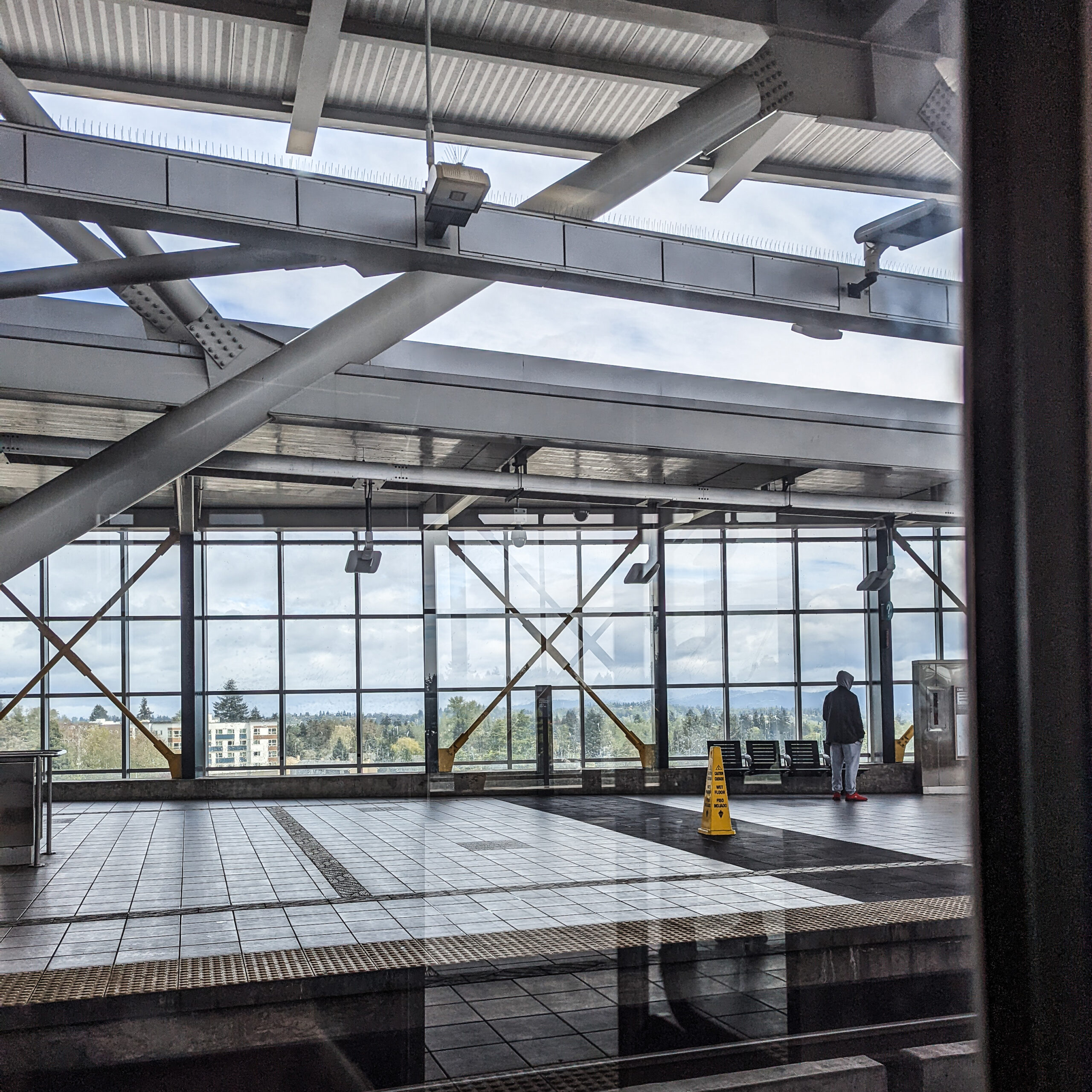 A light rail station in south seattle, as seen from a light rail train car.