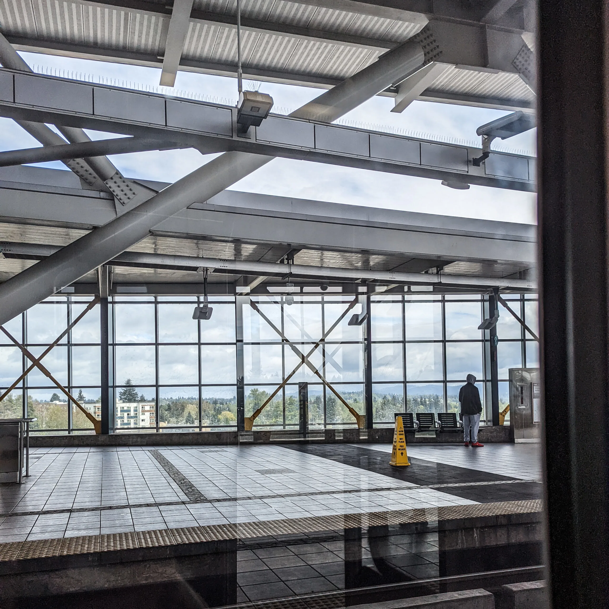 A light rail station in south seattle, as seen from a light rail train car.