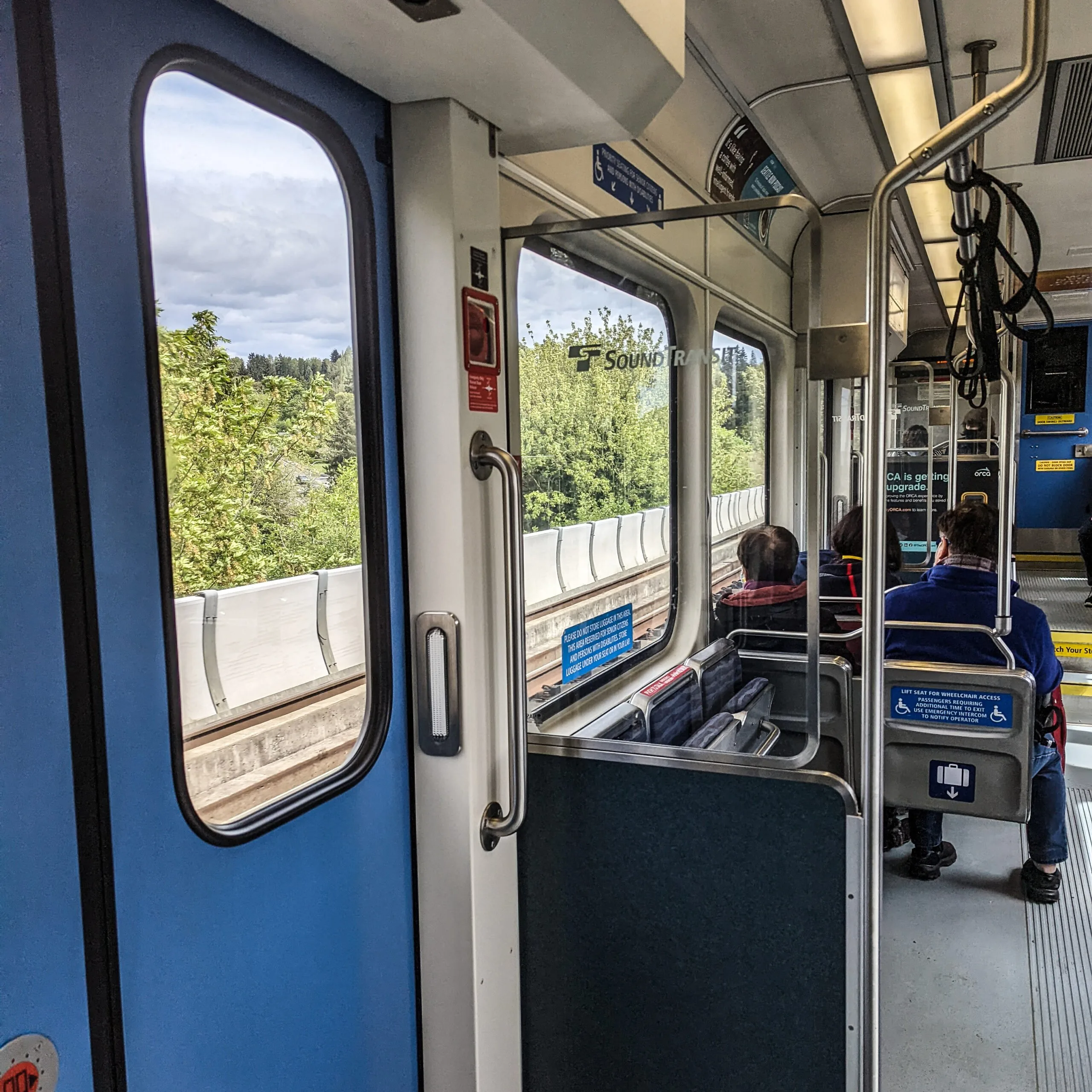 The interior of a nearly empty light rail train in seattle washington.