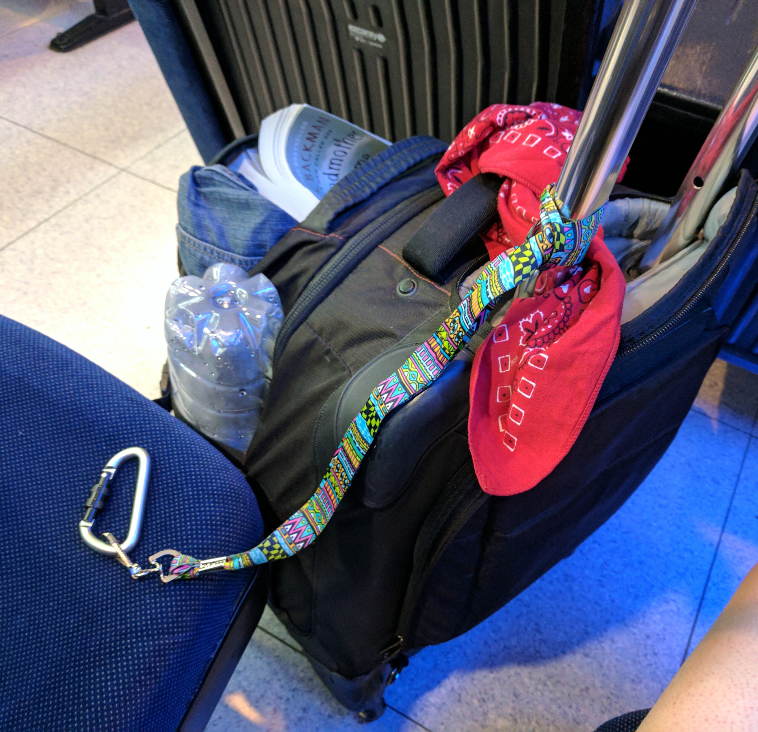 A simple lanyard is enough to tie luggage to a seat or railing and make theft harder.