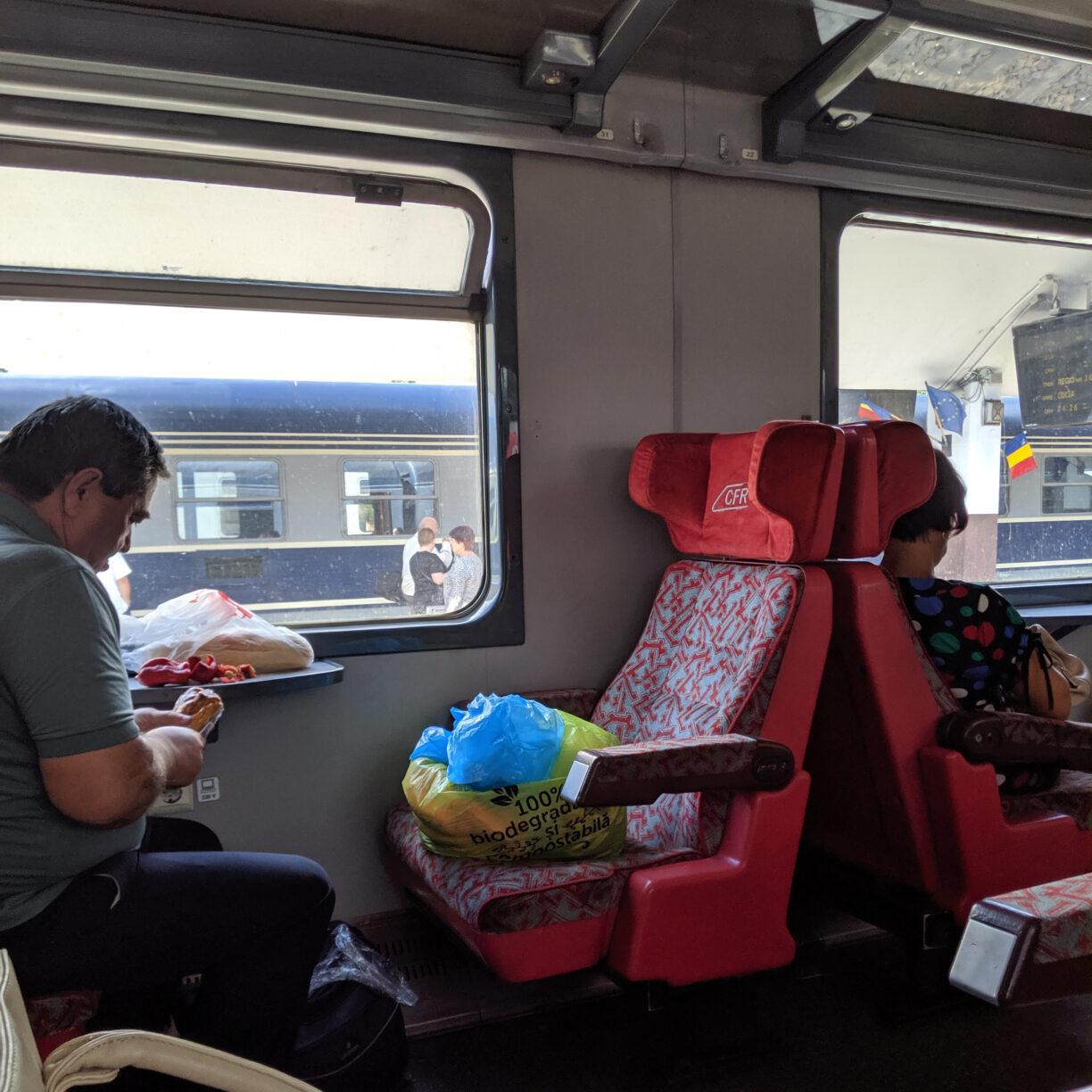 A train passenger prepares a meal on a train and eastern europe.