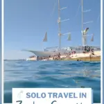 Solo travel in zadar croatia 6 things to do text on image of a boat on the sea.