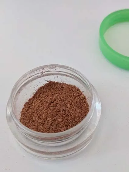 Loose powder in travel container