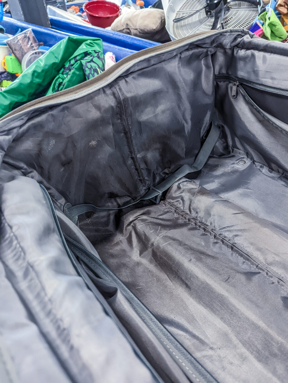 A soiled suitcase liner.