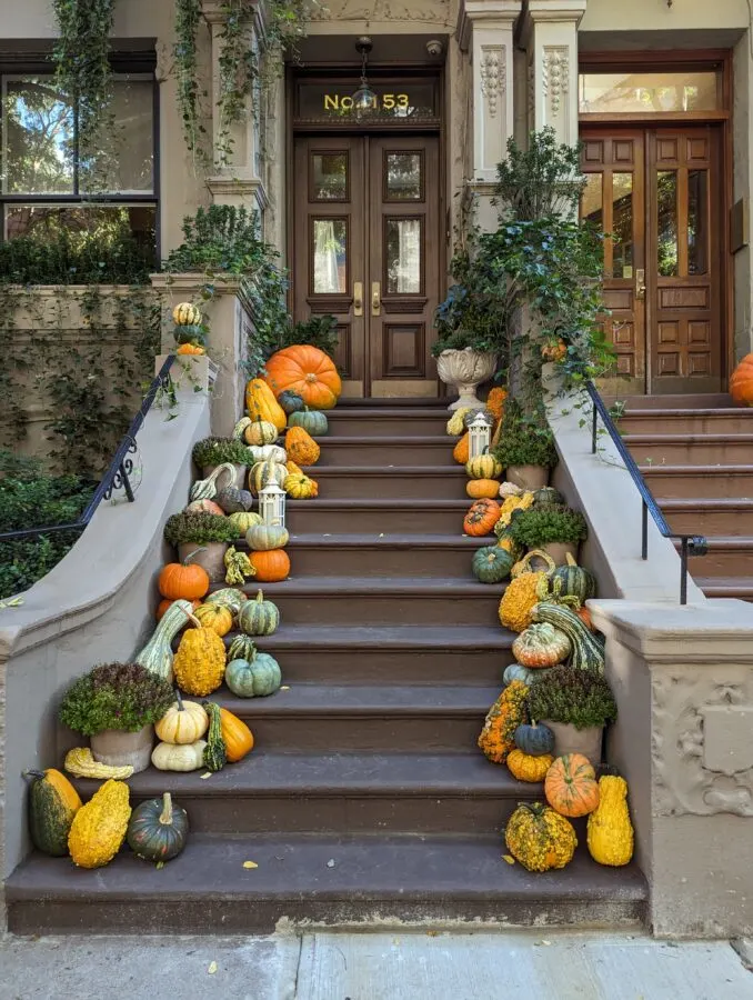 Pumpkins on the steps of a brownstone near central park in manhattan, nyc on halloween.