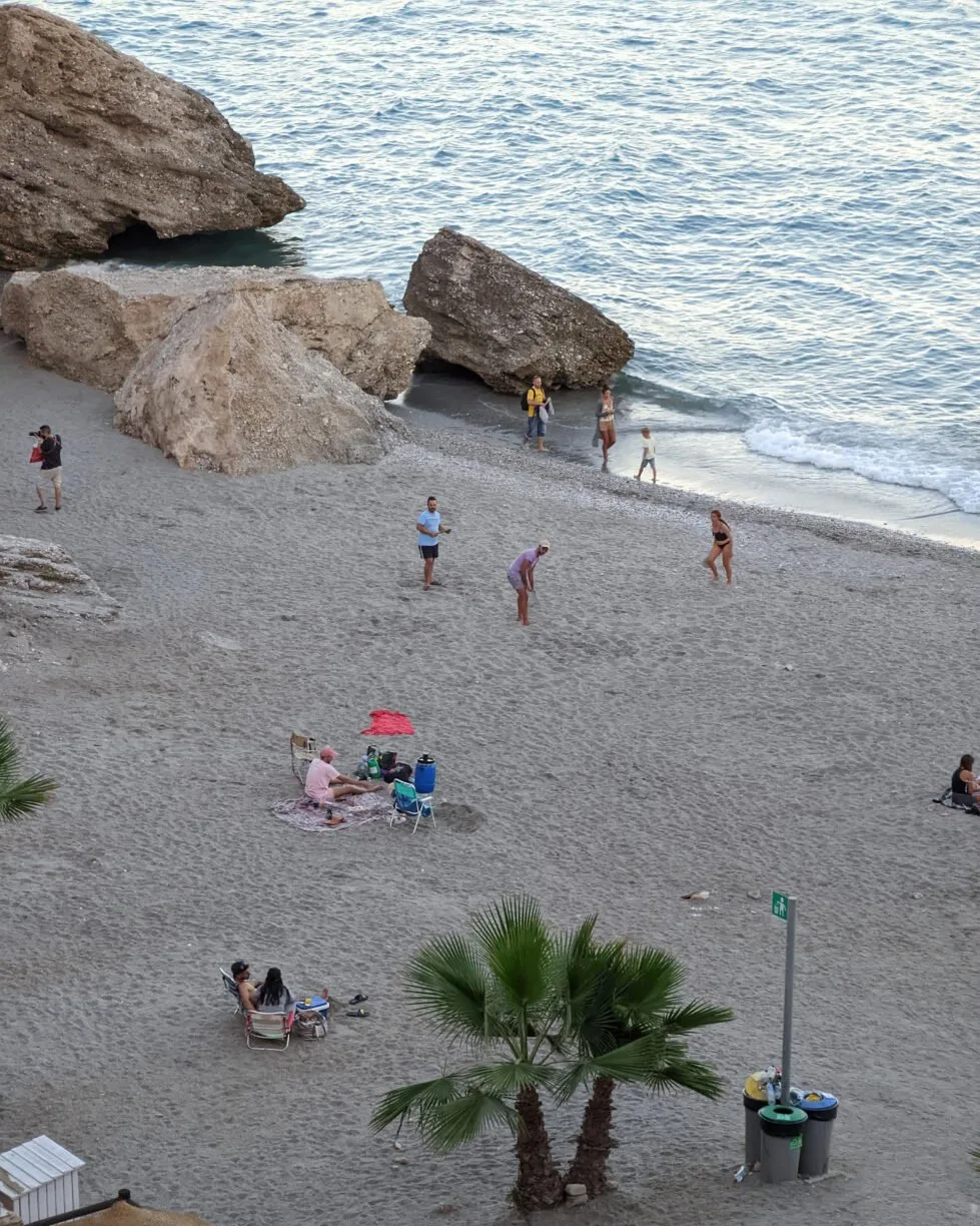 People enjoying typical beach activities on a beach in southern spain.