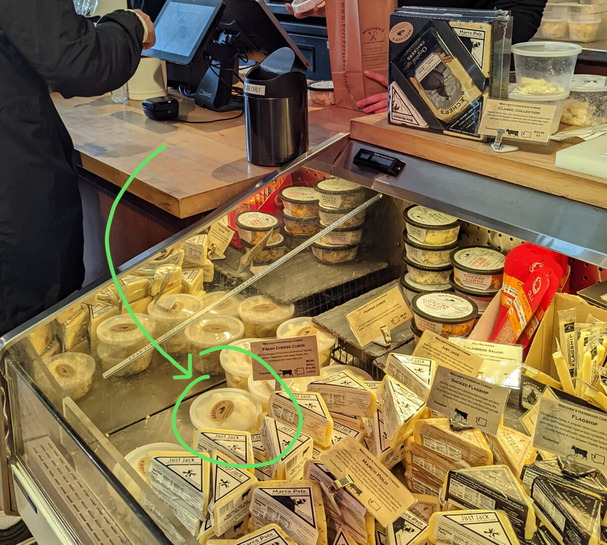 Beechers cheese in a case at pike place market.