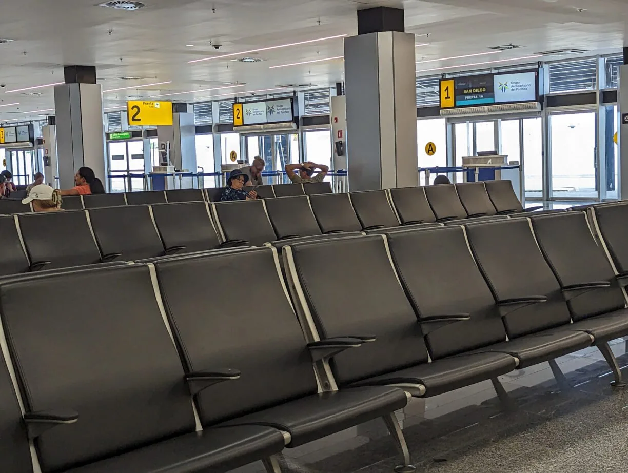 Long rows of empty seats in an airport.