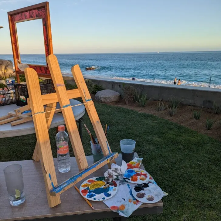 An easel on a beach.