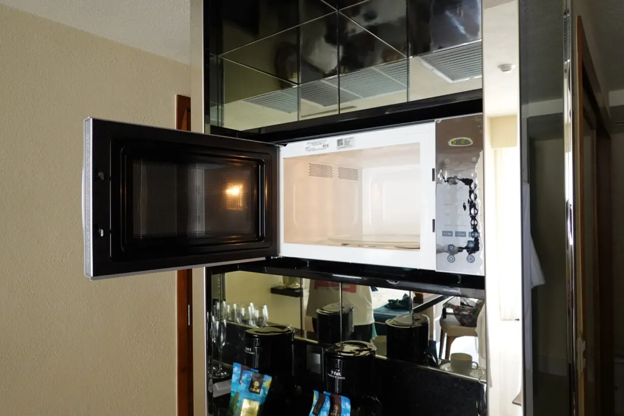 A microwave in a hotel room
