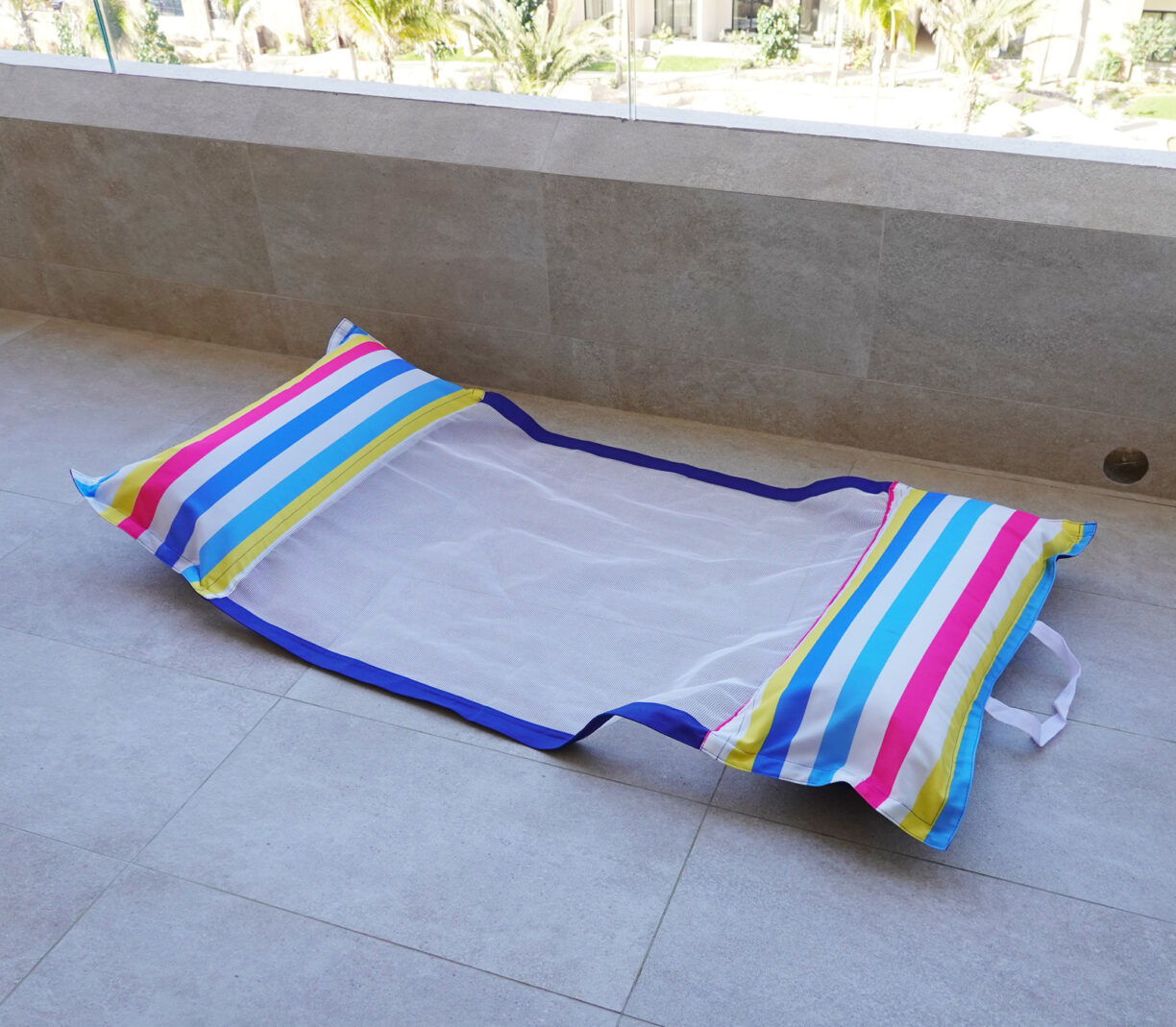 A sling style pool float.