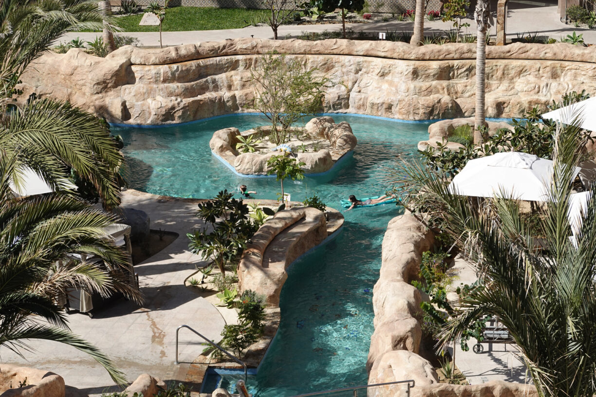A person floating on a lazy river.