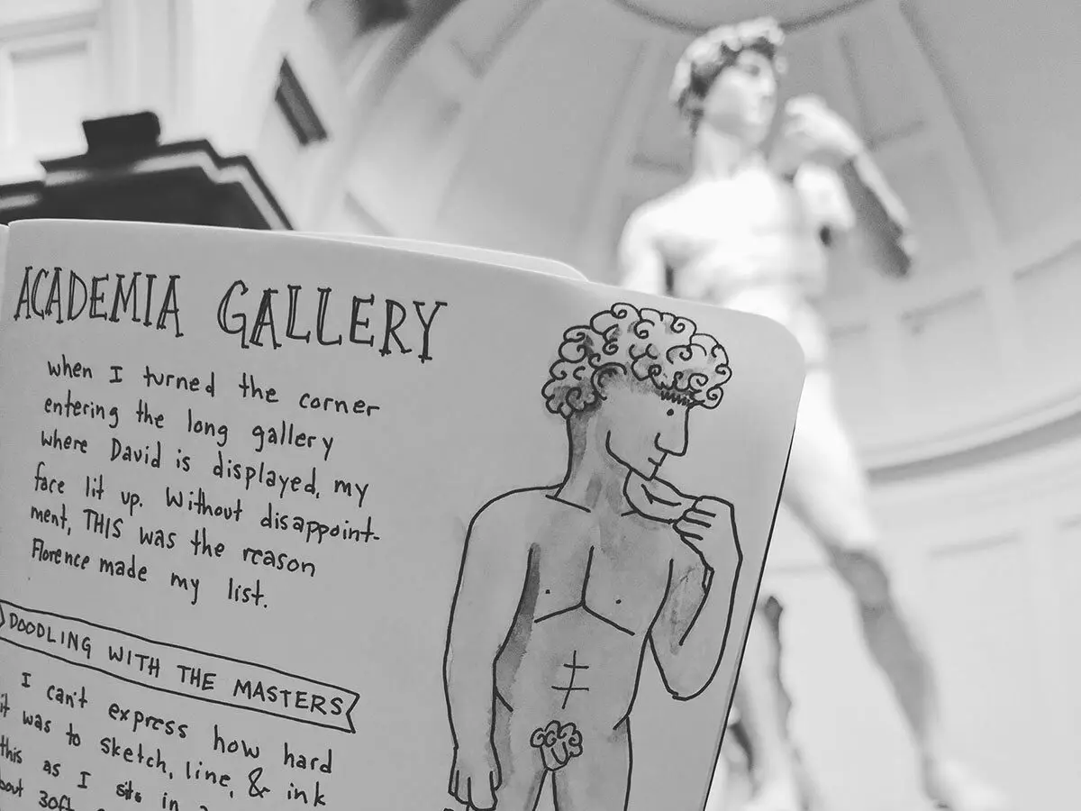 A dodle of the statue of david held in front of the statue of david in florence, italy.