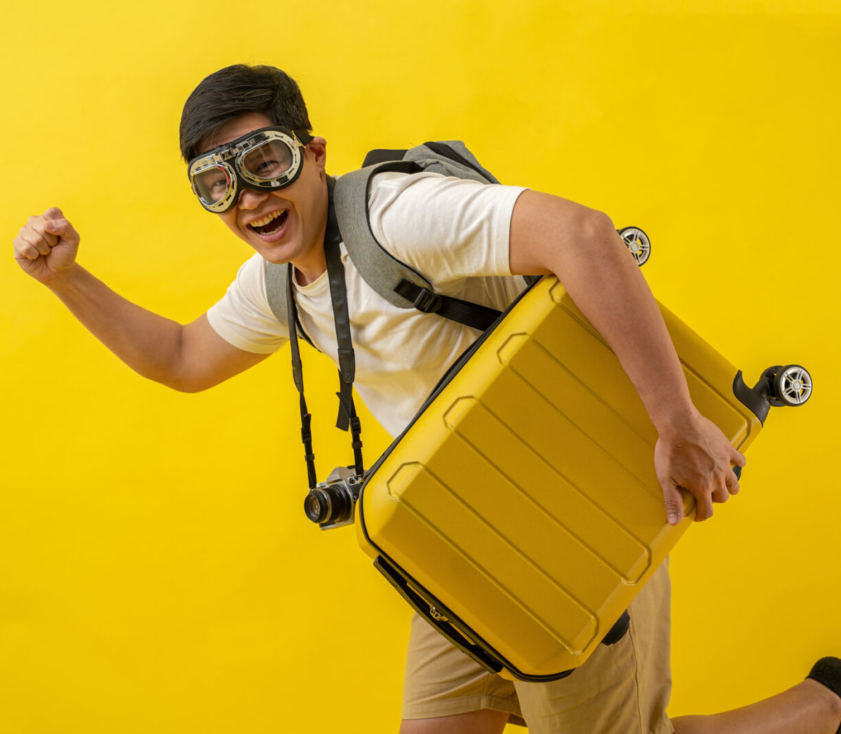A man dressed in an over the top tourist costume.
