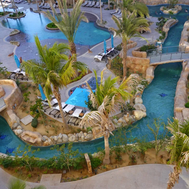 A lazy river winding around a resort, as seen from above.