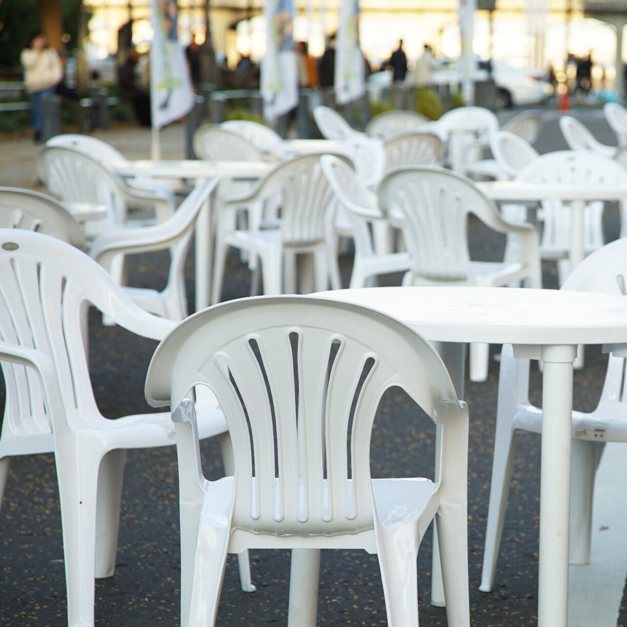 Plastic chairs on a patio.