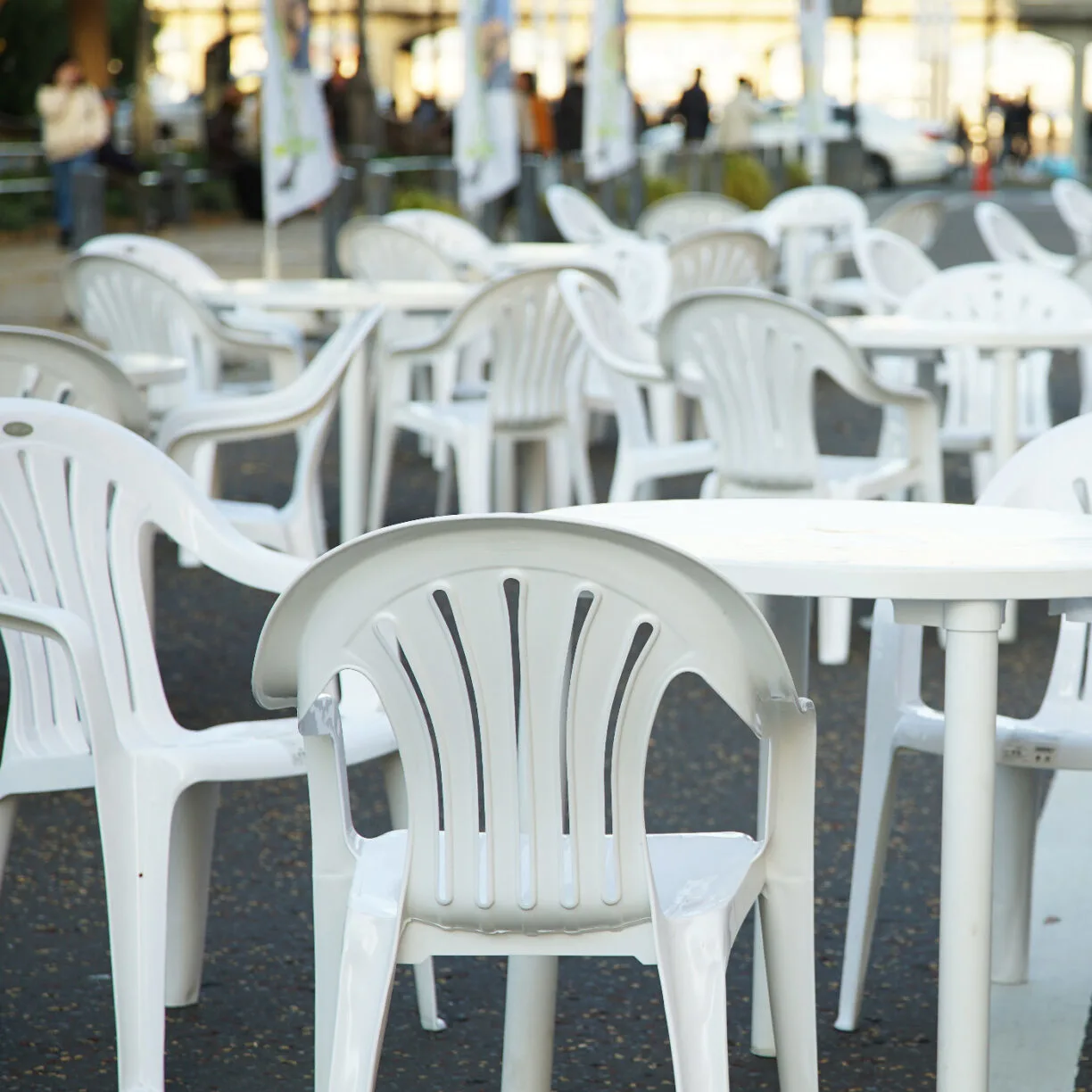 Plastic chairs on a patio.