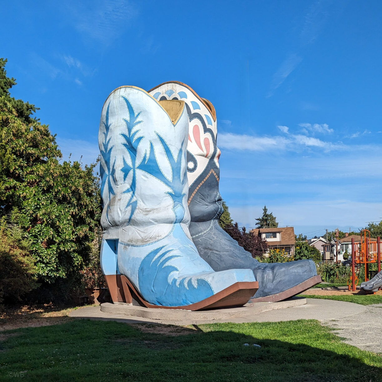 A giant pair of blue cowboy boots in seattle washington park.