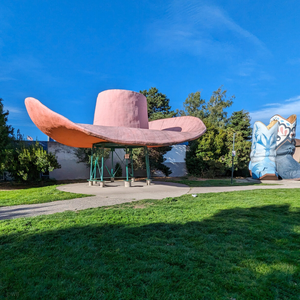A giant hat and boots in a park in seattle washington's georgetown neighborhood.