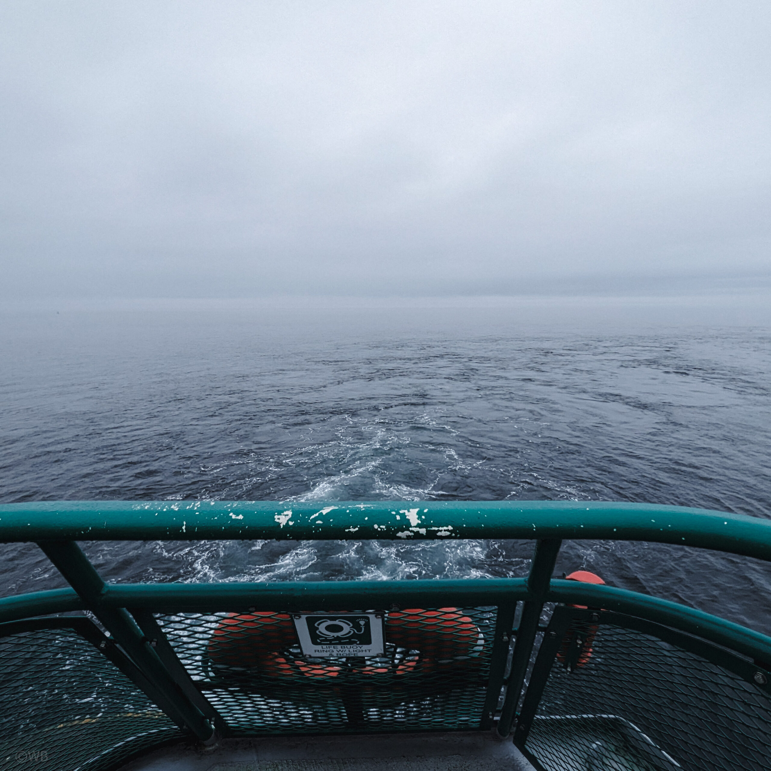 A foggy view from the deck of a washington state ferry.