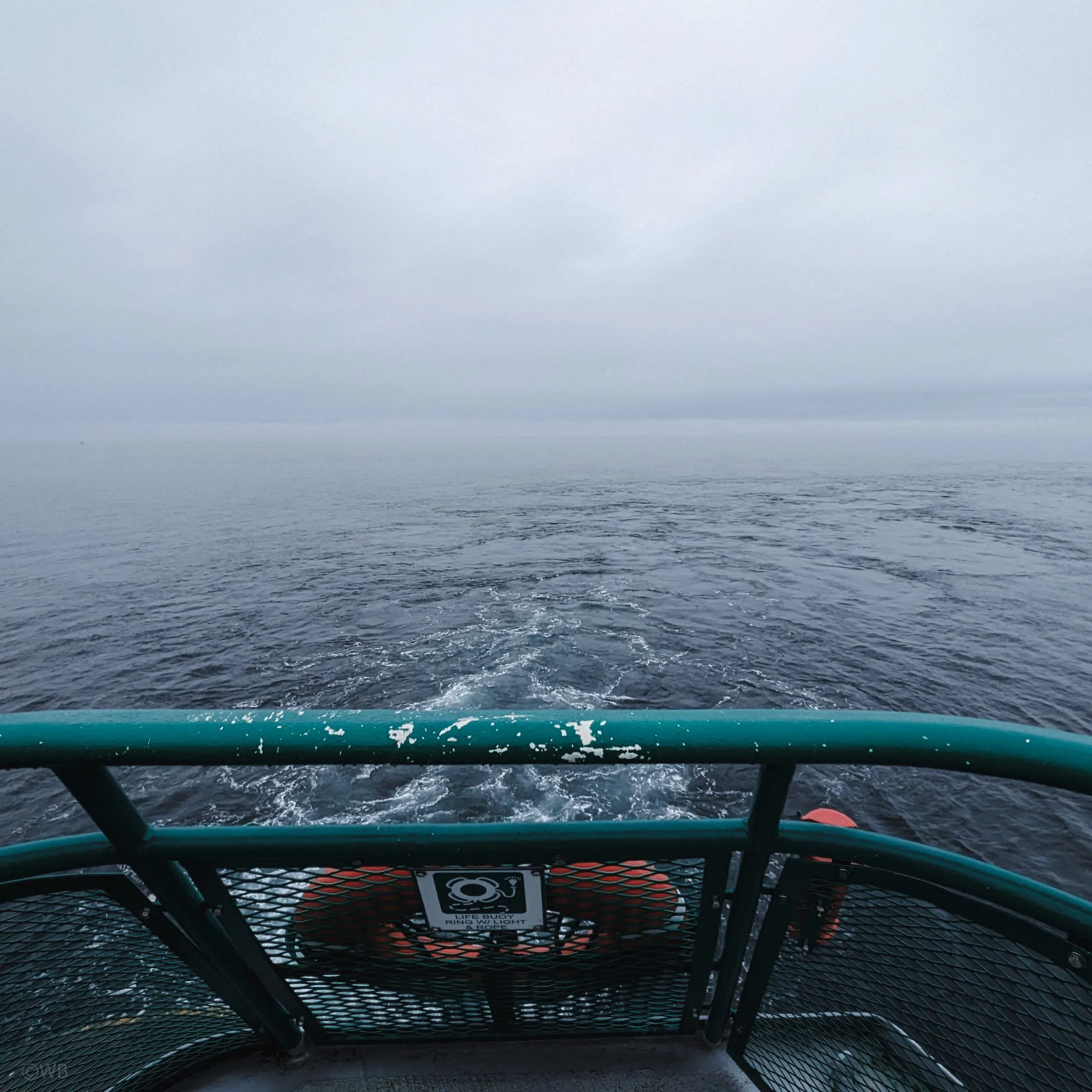 A foggy view from the deck of a washington state ferry.